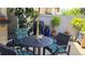 Inviting backyard patio with comfortable seating, stylish decor, and a lush green backdrop at 442 S Carr St, Lakewood, CO 80226