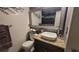 Modern bathroom featuring a stylish sink, granite countertops, and elegant tile work at 442 S Carr St, Lakewood, CO 80226