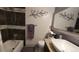 Modern bathroom featuring a stylish sink, granite countertops, and elegant tile work at 442 S Carr St, Lakewood, CO 80226