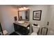 Stylish bathroom featuring modern fixtures, granite countertops, and updated lighting at 442 S Carr St, Lakewood, CO 80226