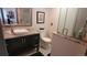 Well-lit bathroom featuring a modern vanity and a sleek, glass-enclosed shower at 442 S Carr St, Lakewood, CO 80226