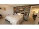 Comfortable bedroom with attractive accent wall and furnishings; inviting and stylish at 442 S Carr St, Lakewood, CO 80226