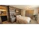 Cozy bedroom with stylish wallpaper, carpet, and gold accents, offering a comfortable retreat at 442 S Carr St, Lakewood, CO 80226