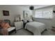 Bright bedroom with light-filled window, comfortable seating, and tasteful decor at 442 S Carr St, Lakewood, CO 80226