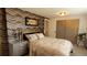 Comfortable bedroom with attractive accent wall and furnishings; inviting and stylish at 442 S Carr St, Lakewood, CO 80226
