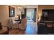 Cozy dining room featuring chandelier lighting, a decorated mirror, and patio access at 442 S Carr St, Lakewood, CO 80226