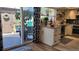 Open concept kitchen with stainless steel appliances and sliding glass doors to the backyard at 442 S Carr St, Lakewood, CO 80226