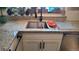 Stylish kitchen features granite counters, stainless steel sink, and sleek cabinetry at 442 S Carr St, Lakewood, CO 80226