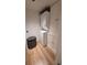 Compact laundry room features stacked washer and dryer with built-in storage cabinets at 442 S Carr St, Lakewood, CO 80226