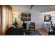 Inviting living room and dining area featuring curated decor, neutral tones and hardwood flooring at 442 S Carr St, Lakewood, CO 80226