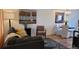 Inviting living room and dining area featuring curated decor, neutral tones and hardwood flooring at 442 S Carr St, Lakewood, CO 80226