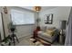 Inviting living room featuring a cozy sofa, stylish decor, and natural light at 442 S Carr St, Lakewood, CO 80226