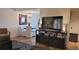 Inviting living room and dining area featuring a mounted TV and modern furniture at 442 S Carr St, Lakewood, CO 80226