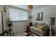 Relaxing living room featuring a soft sofa and curated decor at 442 S Carr St, Lakewood, CO 80226