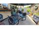 Cozy patio features a dining set, shade umbrella, and planters at 442 S Carr St, Lakewood, CO 80226