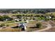 Wide aerial shot showcasing a picturesque park with walking trails, open green spaces, and a charming rural setting at 640 S Yarrow St, Lakewood, CO 80226