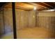 Unfinished basement area with exposed concrete walls and ceiling, offering potential for customization and expansion at 640 S Yarrow St, Lakewood, CO 80226