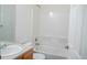 Bathroom features a sink with wooden cabinets and a bathtub at 640 S Yarrow St, Lakewood, CO 80226