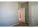 Bedroom with carpet, light gray walls, and a doorway to another room at 640 S Yarrow St, Lakewood, CO 80226