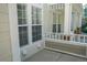 Inviting front porch with white railings, providing a cozy outdoor space at 640 S Yarrow St, Lakewood, CO 80226