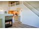 Open-concept living room with adjacent kitchen and unique fireplace feature at 640 S Yarrow St, Lakewood, CO 80226