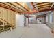 Unfinished basement, featuring exposed beams, concrete flooring, and a blank canvas for customization at 1533 Bellflower Dr, Brighton, CO 80601