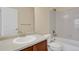 Practical bathroom features a single sink vanity, a mirror, and a shower-tub combination at 1533 Bellflower Dr, Brighton, CO 80601