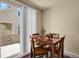 Bright breakfast nook with sliding glass doors that lead to a private deck at 1533 Bellflower Dr, Brighton, CO 80601
