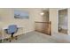 A versatile loft space with neutral carpet, ample natural light, and railing at 1533 Bellflower Dr, Brighton, CO 80601