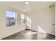 White bedroom featuring hardwood floors, natural light and modern closet door at 10331 E 62Nd Pl, Denver, CO 80238