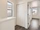 Bright hallway with gray floors, white walls and doors at 10331 E 62Nd Pl, Denver, CO 80238