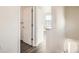 A hallway leading to the doorway shows the wood-look flooring at 10331 E 62Nd Pl, Denver, CO 80238