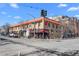 Corner building showcasing a vibrant Mando Vino restaurant, set at a lively street intersection at 4511 Meade St, Denver, CO 80211