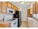 Efficient kitchen featuring ample counter space and wood cabinets at 9519 E Iowa Cir, Denver, CO 80247