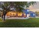 Expansive backyard with a large deck, hot tub, outdoor seating, and manicured lawn perfect for outdoor relaxation and entertainment at 7071 S Gibraltar Way, Centennial, CO 80016