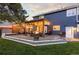 A spacious backyard featuring a large deck with outdoor seating, a hot tub, and a fire pit for outdoor enjoyment at 7071 S Gibraltar Way, Centennial, CO 80016
