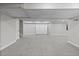 Finished basement space with carpet, recessed lighting, and a storage cabinet for a flexible living area at 7071 S Gibraltar Way, Centennial, CO 80016