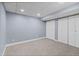 Finished basement room with carpet, neutral walls, closet and lighting at 7071 S Gibraltar Way, Centennial, CO 80016