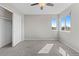 Neutral bedroom with carpet, two windows, and a closet with sliding doors, offering a serene space at 7071 S Gibraltar Way, Centennial, CO 80016