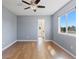 Bedroom with hardwood floors and a view of the outdoors from the window at 7071 S Gibraltar Way, Centennial, CO 80016