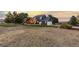 Spacious two-story home boasts a large backyard, inviting deck, and attached garage nestled in a serene setting at 7071 S Gibraltar Way, Centennial, CO 80016