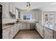 Bright kitchen with granite countertops, stainless steel appliances, and ample cabinet space at 7071 S Gibraltar Way, Centennial, CO 80016