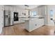 Well-equipped kitchen with stainless steel appliances and granite countertops at 7071 S Gibraltar Way, Centennial, CO 80016