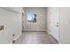 Spacious mud room with a window and a door to the exterior at 7071 S Gibraltar Way, Centennial, CO 80016