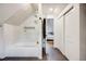 Modern bathroom with a glass-enclosed shower/tub, contemporary fixtures, and sleek design at 4673 Bryant St, Denver, CO 80211