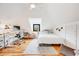 Bright bedroom with hardwood floors, desk and modern black trim window at 4673 Bryant St, Denver, CO 80211