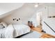 Upstairs bedroom featuring white walls, light wood flooring, and natural light at 4673 Bryant St, Denver, CO 80211