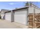 Detached garage with two doors offers convenient parking and additional storage space at 4673 Bryant St, Denver, CO 80211