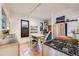 Spacious kitchen with tiled floors, butcher block island, stainless steel appliances, and ample counter space at 4673 Bryant St, Denver, CO 80211