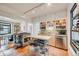 Bright kitchen with stainless steel appliances, open shelving, and tile flooring at 4673 Bryant St, Denver, CO 80211
